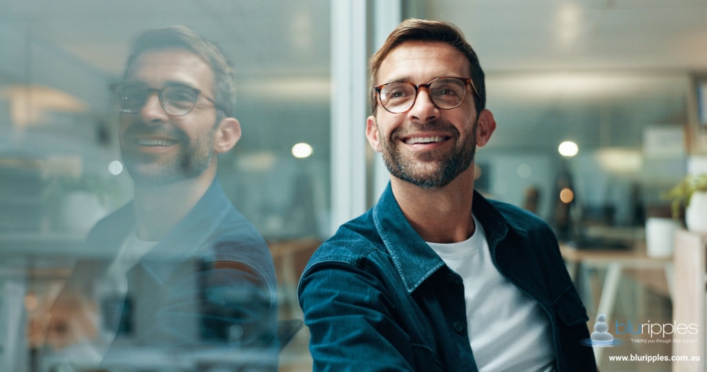 Blu Ripples Career Counselling - Male client in a professional office reflecting on career options to gain clarity and explore future career directions
